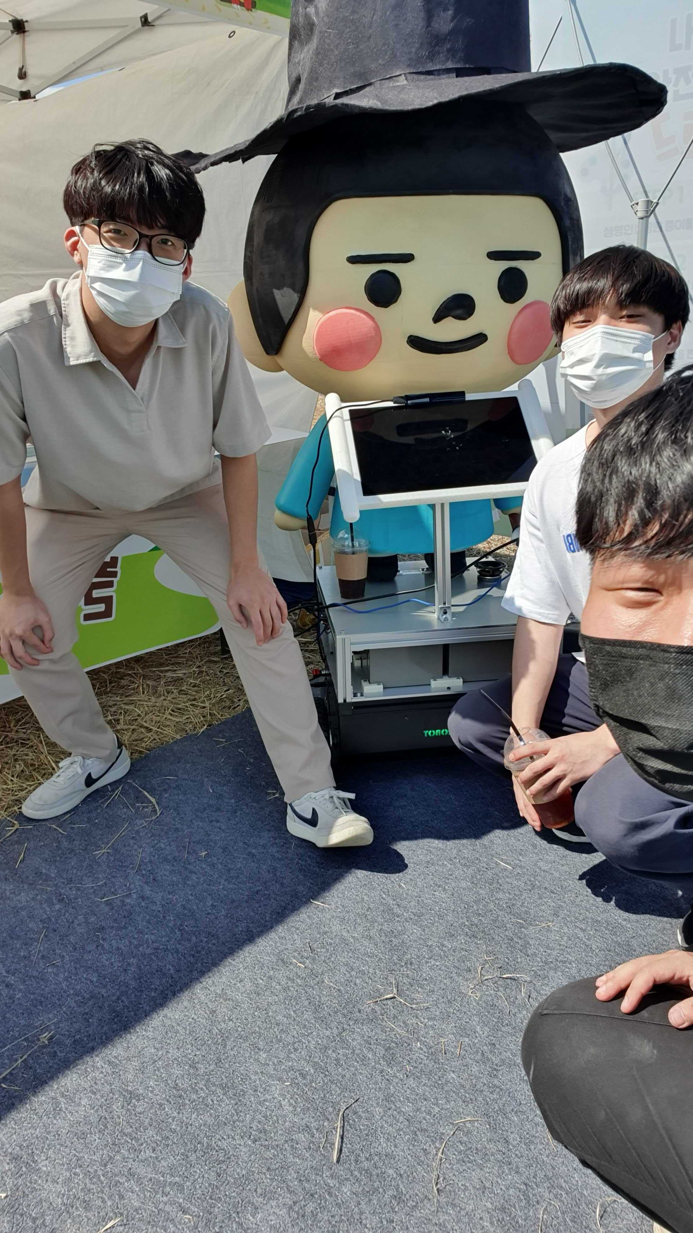 Team members posing with Hongdo at Ansan Everyone's Playground Festival.
